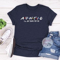 Show your love to your family with our personalized family shirts. This Auntie shirt is based off the Friends TV Show. Perfect Gift for Aunt who is a Friends addict. Choose your favorite shirt from a wide variety of unique high quality designs and colors. Casual Tops With Custom Print For Family Gatherings, Casual Graphic Print Shirt For Family Gatherings, Funny Family Shirt With Letter Print, Crew Neck Shirt With Letter Print For Family Reunion, Funny Customizable Tops For Family, Casual Customizable T-shirt For Family Gatherings, Cotton Tops With Name Print For Family Reunion, Funny Cotton T-shirt For Family Reunion, Customizable Blue Tops For Family Occasions