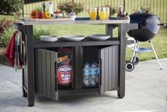 an outdoor bar cart with drinks on it