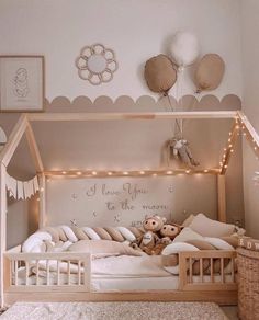 a child's room with a bed, teddy bear and lights on the wall