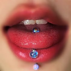 a woman's mouth with water droplets on it and a diamond in the middle