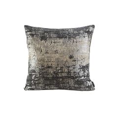 a black and silver pillow on a white background