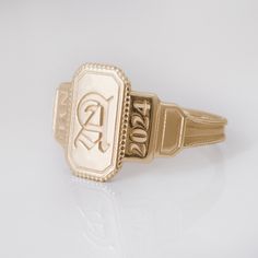 This vintage style signet ring is inspired the Art Deco style and is a perfect vintage-style graduation ring for high school or college grads! A truly stand-out ring to last forever - and makes a perfect gift!  This ring can be customized with any letter or word (provided it fits) and is made in solid gold. This ring can be made for men or women and in your preferred size or color of gold. A phrase or letter may be written on the inside, too! Please note that up to 4 characters are available for State Champ Ring, Vintage Gold Signet Ring, Meredith College Ring, Simple Class Rings High School, Class Rings High School Reeds Jewelers, Class Rings High School Vintage, Baylor University Class Ring, Class Ring Alternative, Senior Ring Ideas