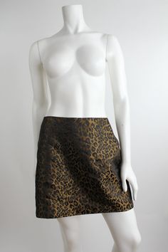 "Lightweight leopard print a-line mini skirt from the 1990s. Zipper at center back.  DETAILS Condition: Excellent! Minimal signs of wear.  Label + Era: La Belle, Made in USA; 1990s Color: Brown, black Fabrication: 50% polyester, 50% nylon Marked size: 11 Fits like: M to L MEASUREMENTS Waist:            31\"         |  78.7cm Hips:             42.25\"    |  107.2cm Total length: 16\"         |  40.5cm" Leopard Print Mini Skirt, Print Mini Skirt, A Line Mini Skirt, Perfect Shoes, A Line Skirt, A Line Skirts, Mini Skirt, Leopard Print, Made In Usa