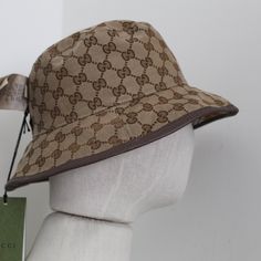 Product Description Gucci Reversible Bucket Hat Wool In A Close Weave Flat Crown Dropped Brim Front Logo Patch All-Over Check Motif All-Over Logo-Jacquard Motif At Reverse Made In Italy Brown Leather Trim Double G Made In Italy Gucci Adjustable Bucket Hat, Gucci Brown Short Brim Hat, Gucci Brown Curved Brim Hat, Gucci Adjustable Brimmed Hat, Gucci Adjustable Flat Brim Hat, Gucci Designer Wide Brim Hat, Designer Wide Brim Beige Hats, Designer Beige Wide Brim Hat, Classic Gucci Hat With Curved Brim