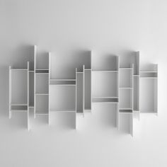 an empty white shelf with five shelves on each side, in the shape of rectangles