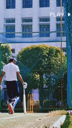 a man standing on top of a tennis court holding a racquet in his hand