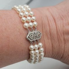 This Lovely Estate Bracelet Features 90 5mm Cream Cultured Pearls On 3 Strands With A 14k White Gold Edwardian Clasp. It Is 7" Long And Each Strand Is Separated By 2 Gold Bars: 8 Pearls - Bar - 14 Pearls Bar - 8 Pearls: 30 Pearls On Each Strand. It Has A Push Clasp And Is In Excellent Condition. The Pearls Have Not Been Graded. Delicate, Feminine Bracelet!! Feminine Bracelet, Cultured Pearl Bracelet, Gold Bars, Delicate Feminine, Gold Bar, Cultured Pearls, Pearl Bracelet, Womens Jewelry Bracelets, White Gold