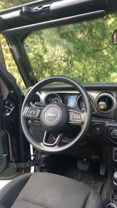 the interior of a vehicle with dashboard and steering wheel