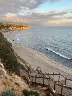 stairs lead down to the beach and ocean