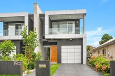 two story house with large front yard and driveway