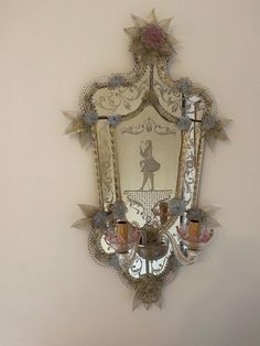 an ornate mirror hanging on the wall