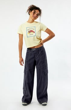 Step into street-style confidence with the Navy Low Rise Baggy Cargo Pants from PacSun. These pants feature a low-rise waist, contrast stitching throughout for added flair, belt loop details around the thigh, and cargo and patch pockets for utility. With their relaxed baggy fit, they offer both comfort and a bold, streetwear-inspired look for any casual outing.   	Model is wearing a size 26 	Model measurements: 5’7” height, 32” bust, 24” waist, 35” hip Baggy Clothes Women, Navy Cargo Pants Outfit, Low Rise Baggy Cargo Pants, Baggy Cargo Pants Outfit, Outfit Ideas Cargo, Outfit Ideas Cargo Pants, Nike Pro Outfit, Young Mom Style, Cargo Pants Outfit Ideas