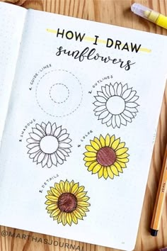 an open notebook with sunflowers drawn on it and some crayons next to it