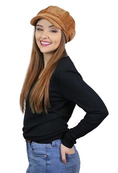 a woman with long hair wearing a brown hat and black shirt is smiling at the camera