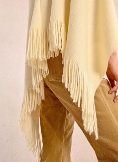 Short poncho-Soft to the touch-Round neckline-Fringes at the ends-Length from the shoulder 75 cm (for one size) Fabrics ▴ Main material: 100% acrylic Beige Fringed Poncho Shawl, Beige Fringe Shawl Poncho, Oversized Fringe Cape For Fall, Winter Cape With Tassels, Fringe Shawl Cape For Fall, Winter Fringe Cape Shawl, Fall Shawl Cape With Fringe, Oversized Shawl Poncho With Tassels, Fringe Poncho Cape For Fall