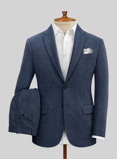 Everyone needs classic tweed in their tailoring repertoire and the stunning Empire Blue suit is a perfect choice. Crafted from wool, the relaxed structure of the suit will make it an all time favorite piece. Complete your outfit with matching waistcoat, a white shirt and oxford shoes. 
 
Look Includes   Empire Blue Tweed Fabric  Two Button Jacket Style  Notch Lapel  Horn Royal Black Buttons  Single Vent  Three Cuff Buttons  Two Welted Back Pockets on Trousers   Click 'Customize Now' to modify the look if needed. 
 
Lining: Viscose; Dry Clean. Tweed Notch Lapel Suit For Business Casual, Business Casual Tweed Suits With Notch Lapel, Tailored Tweed Suits For Business Casual, Wool Suits With Herringbone Pattern For Business Casual, Business Tweed Suit With Pockets, Semi-formal Tweed Suits With Pockets, Classic Tweed Suit For Business Casual, Classic Tweed Business Casual Suit, Classic Tweed Suits With Pockets