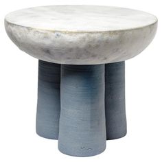 two blue and white pedestals with one sitting on top