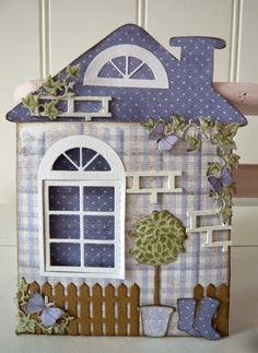 a paper doll house made to look like it's outside