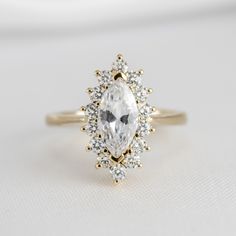 Shown in 1.25 Carat * The Hadley Marquise Diamond Engagement Ring | Lisa Robin#color_14k-yellow-gold Marquise Diamond Ring Vintage, Engagement Ring Quiz, Round Diamond Halo Engagement Ring, Round Diamond Engagement Rings Halo, Round Diamond Halo, Marquise Diamond Engagement Ring, Colored Engagement Rings, Buying An Engagement Ring, Diamond Halo Engagement Ring