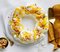 a cake on a plate with nuts around it