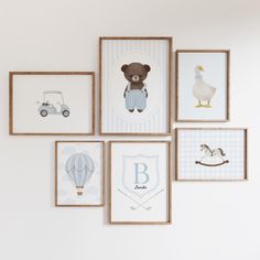 there are many framed pictures on the wall with animals and cars in them, including a teddy bear