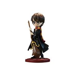 a harry potter figurine holding a wand