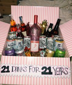 a pink and white box filled with lots of drinks