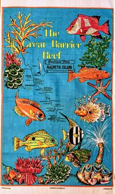 the great barrier reef tea towel with fish and corals on blue background, in front of an ocean scene