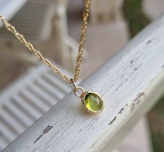 "Gold Peridot Necklace, Gold Pendant Necklace, August Birthstone Necklace, 14k gold necklace, Layering necklace, Green gemstone necklace This minimalist layering Peridot necklace was designed in clean, chic design, with a sheer Grass green August birthstone pendant. This pendant necklace will beautifully accompany you through your busy days and the classic design is always pretty for day and evening, work or fun. Materials: The green Peridot pendant necklace is handmade and delicate and availabl Necklace Gold Pendant, August Birthstone Necklace, Green Gemstone Necklace, Wedding Bridesmaid Jewelry, Peridot Pendant, Peridot Necklace, Necklace Layering, August Birthstone, Necklace Green