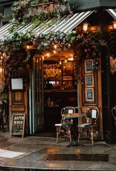 the outside of a restaurant with tables and chairs