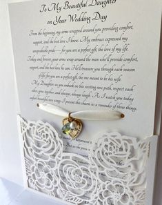 a white card with a heart on it and a poem written in the middle that says, to my beautiful daughter on your wedding day