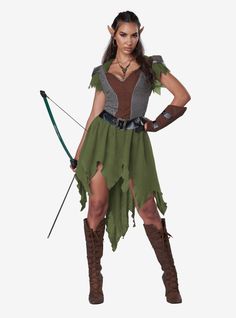 a woman dressed in a costume holding a bow and arrow with both hands on her hips