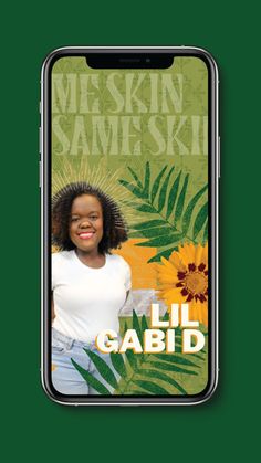 a cell phone with an image of a woman in white shirt and green leaves on the screen