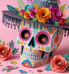 a colorful sugar skull with flowers on it's head, surrounded by confetti