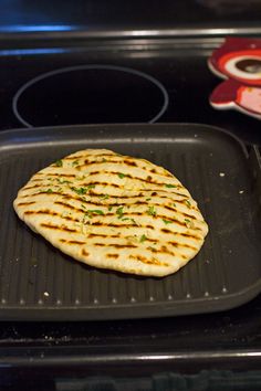 flat bread is cooking on the grill in the oven and ready to be cooked for dinner