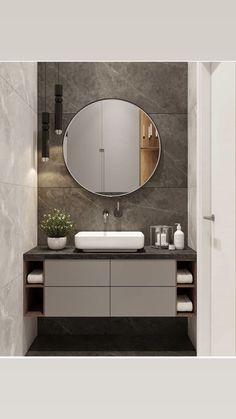 a bathroom with a sink and mirror in it