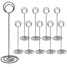 an image of a set of metal circles and poles with spirals on each side