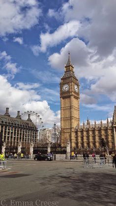 the big ben clock tower towering over the city of london on a partly cloudy day