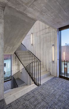 an empty room with stairs leading up to the second floor