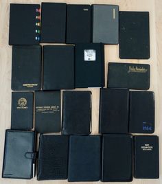 there are many different black books on the table