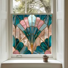 a stained glass window with an artistic design