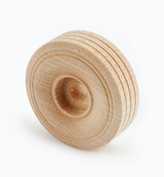 a close up of a wooden object on a white background