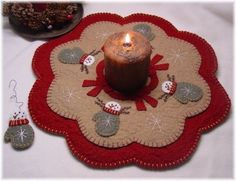 a candle is lit on top of a placemat