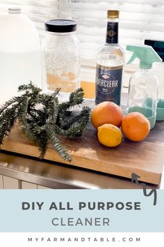 the ingredients for diy all purpose cleaner are displayed on a cutting board with pine branches