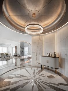 an elegant living room with marble flooring and circular chandelier above the table