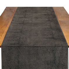 a brown rug on top of a wooden table