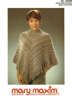 a woman wearing a knitted shawl with fringes