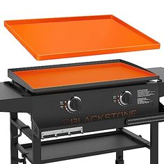 an orange table top grill with the lid open