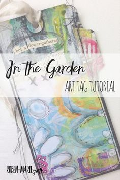 an art tag with the words in the garden on it and some other things around it