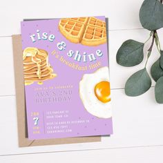 a birthday card featuring pancakes, eggs and waffles on a purple background with eucalyptus leaves